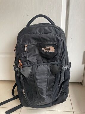 The North Face Black Backpack with Copper Accent Zippers